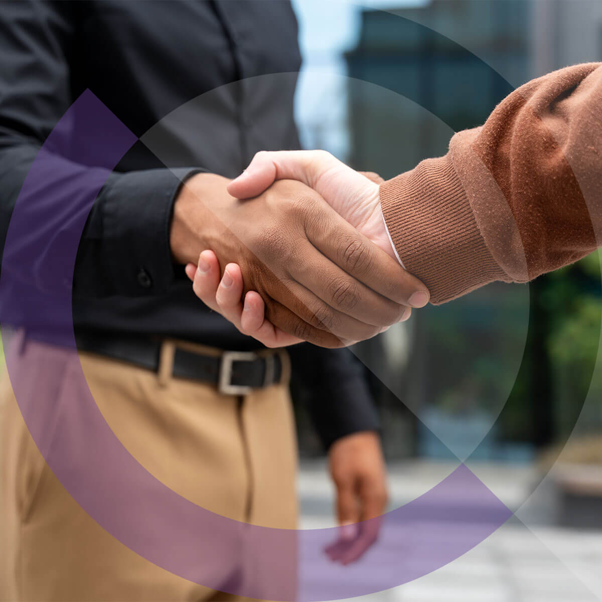 Two people shaking hands.